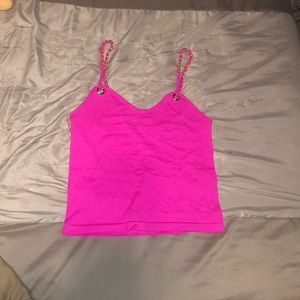 Pink tank top with chains around the straps